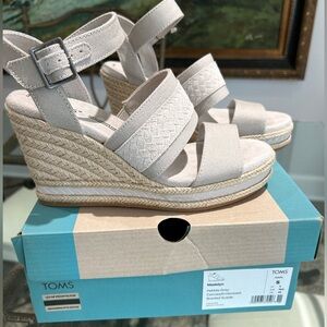 Never worn. Tom’s canvas/embossed braided suede. Size 5.